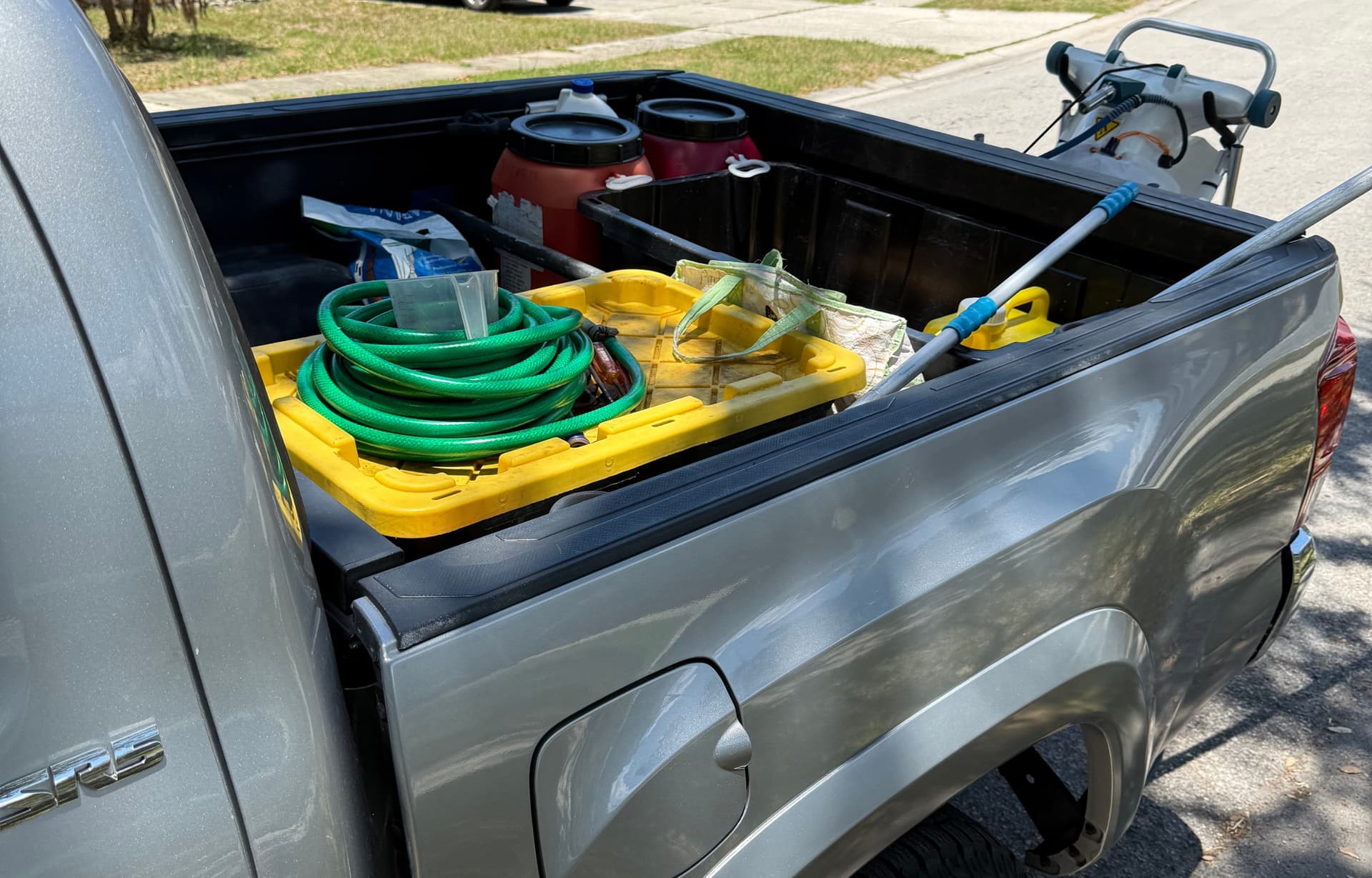 Professional pool maintenance equipment organized in service truck